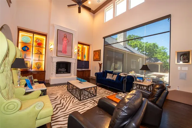 a living room with fireplace furniture and a window