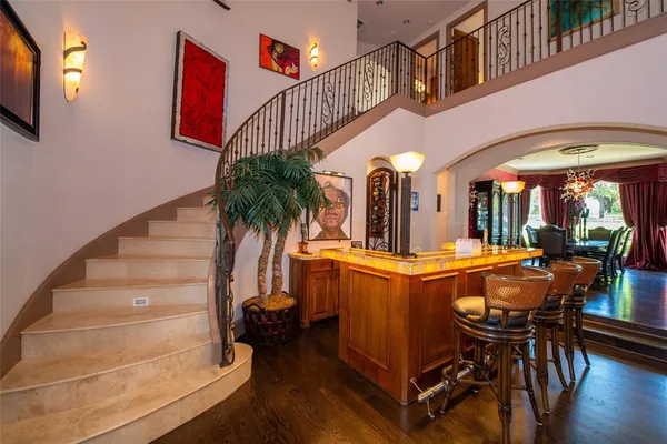 a room with dining table and chairs