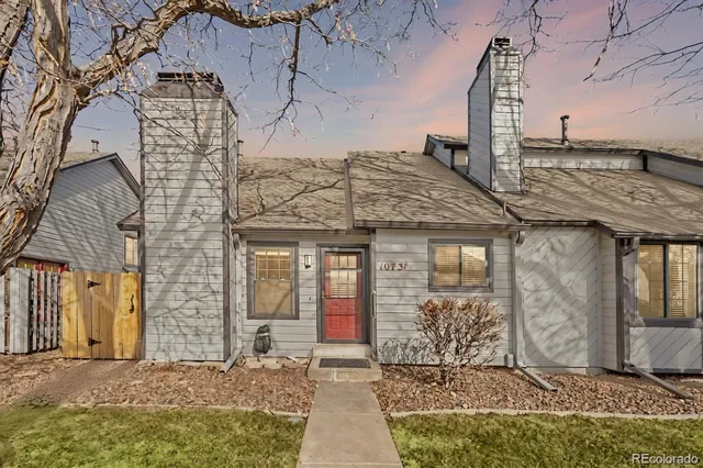 a front view of a house with large windows