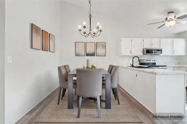 a view of a dining room with furniture and wooden floor