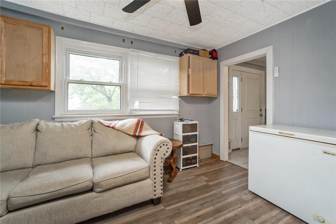 3031 Shakespeare Road Bethlehem, PA 18017 - Photo 13 of 30 Laminate flooring and a ceiling fan enhance this flexible living area.