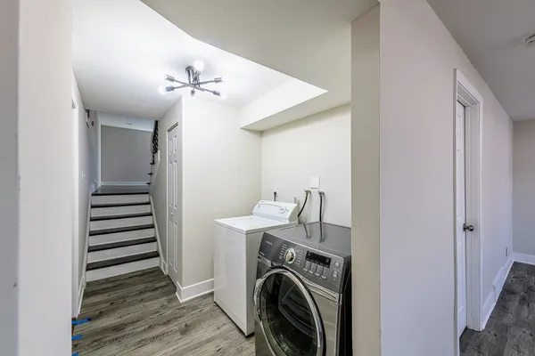 a view of a hallway with washer and dryer