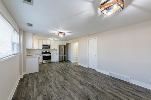 a view of kitchen and wooden floor
