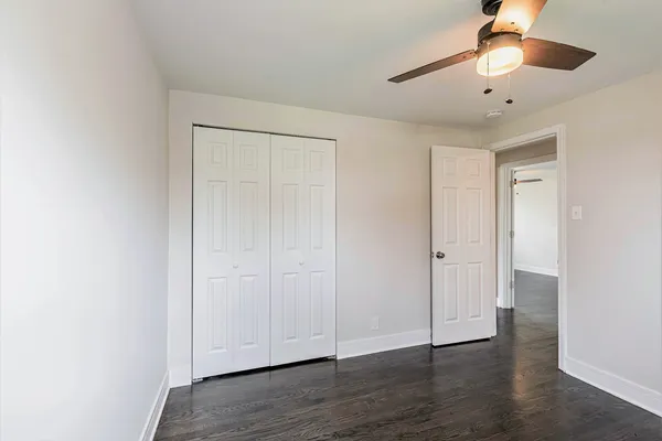 a view of an empty room and wooden floor