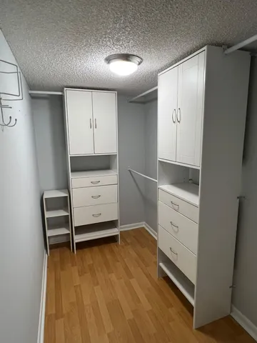 a view of hallway with a sink and a large window