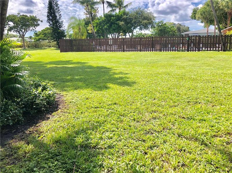 2335 Southwest 22nd Avenue, Unit 1030 Delray Beach, FL 33445 - Photo 21 of 41 a view of swimming pool with outdoor space and garden