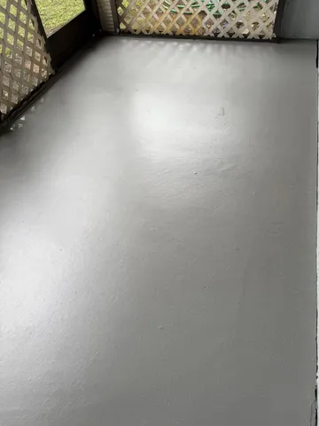 a bathroom with a granite countertop shower a toilet and a sink