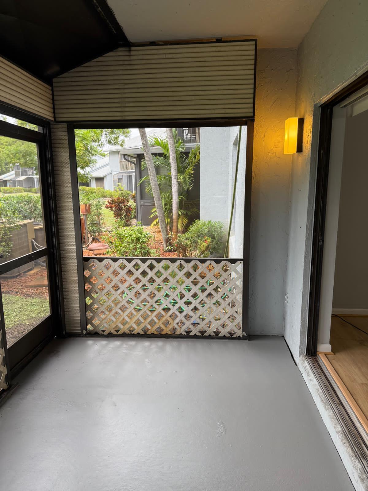 2335 Southwest 22nd Avenue, Unit 1030 Delray Beach, FL 33445 - Photo 28 of 41 a view of a room with a large window and yard
