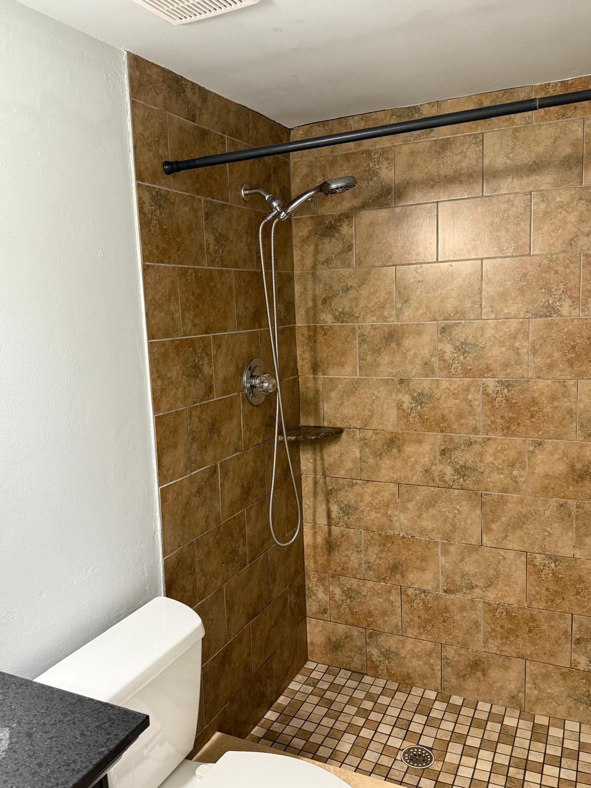 2335 Southwest 22nd Avenue, Unit 1030 Delray Beach, FL 33445 - Photo 31 of 41 a bathroom with a toilet and a shower