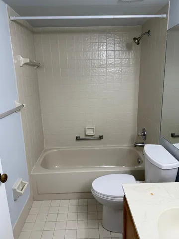 a bathroom with a sink vanity and toilet