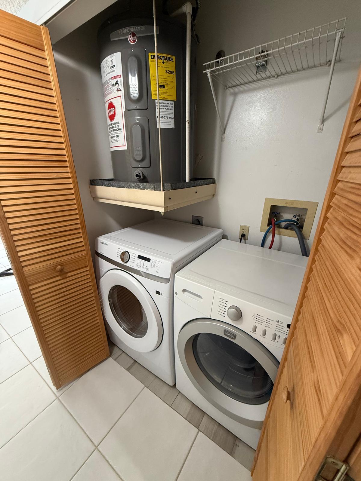 2335 Southwest 22nd Avenue, Unit 1030 Delray Beach, FL 33445 - Photo 36 of 41 a utility room with dryer and washer