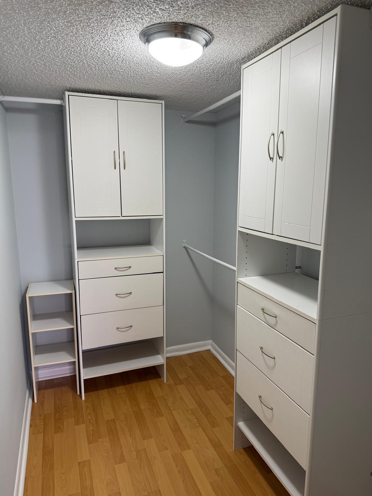 2335 Southwest 22nd Avenue, Unit 1030 Delray Beach, FL 33445 - Photo 38 of 41 a view of an empty room with cabinet and wooden floor