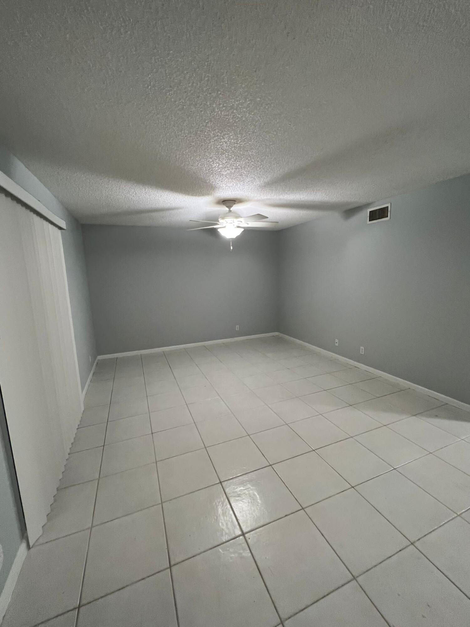 2335 Southwest 22nd Avenue, Unit 1030 Delray Beach, FL 33445 - Photo 6 of 41 a view of an empty room with a window