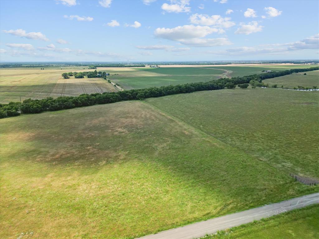 6512 County Road 1050 Celeste, TX 75423 - Photo 20 of 22 a view of an outdoor space and a yard