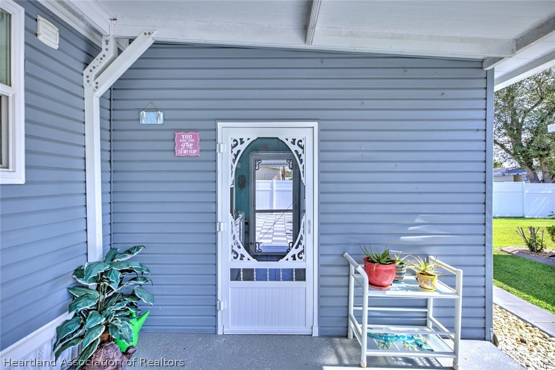 2702 Rodney Street Sebring, FL 33872 - Photo 24 of 33 a front view of a house with garden