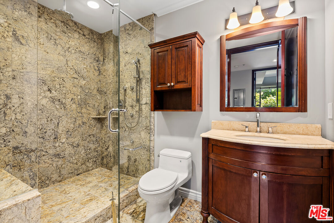 632 North Kings Road, Unit 102 West Hollywood, CA 90048 - Photo 7 of 13 a bathroom with a sink a toilet and shower