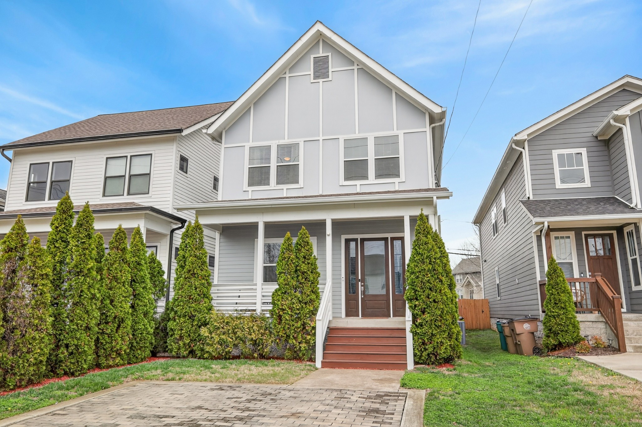5812 Morrow Road, Unit A Nashville, TN 37209 - Photo 2 of 34 a view of a house with brick walls and a yard with plants