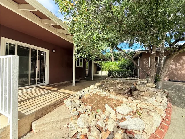 front view of a house with a patio