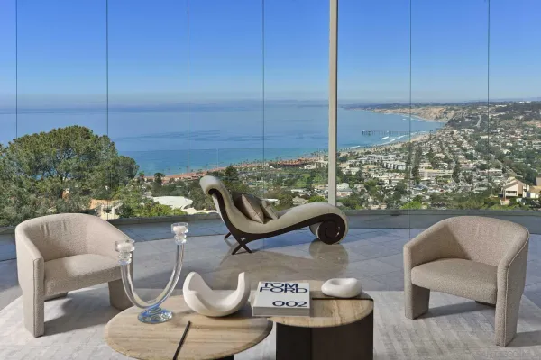 a balcony with table and chairs