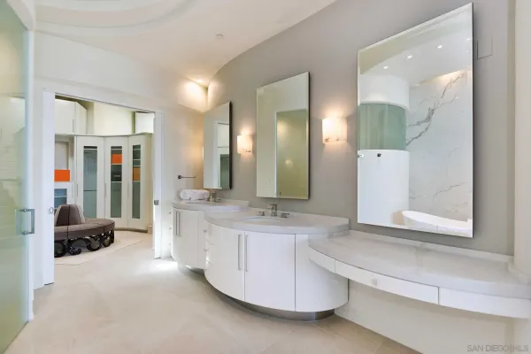 a bathroom with a double vanity sink and a mirror