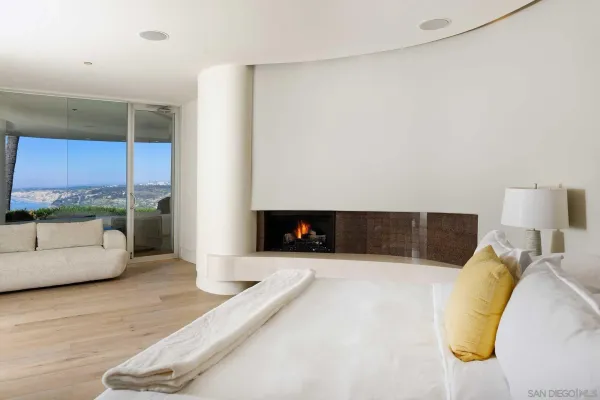 a living room with a couch and a fireplace