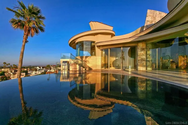 a swimming pool with outdoor seating and yard