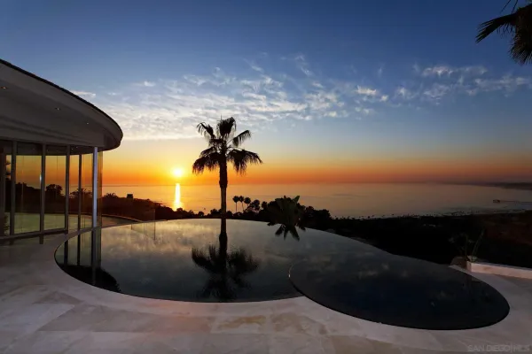 a view of a swimming pool with an outdoor seating