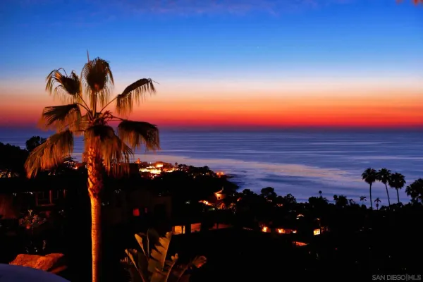 a view of a swimming pool with a table and chairs