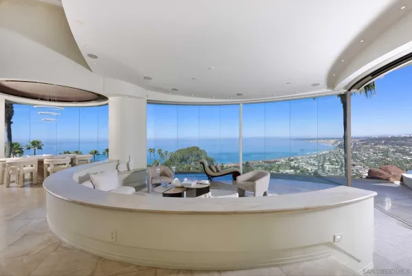 a view of a living room and kitchen