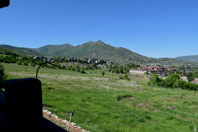 514 North Olympic Way Midway, UT 84049 - Photo 7 of 30 Expansive hillside panorama featuring verdant fields, distant mountain ranges, and scattered residential structures