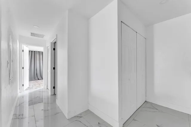 a view of a hallway with a room