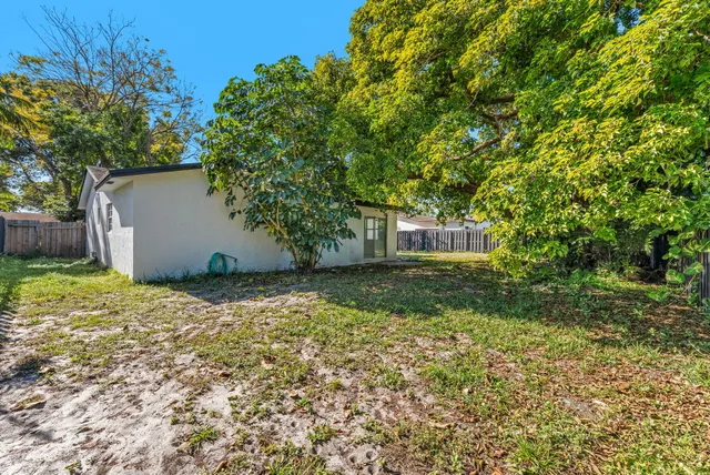 a backyard of a house with lots of green space