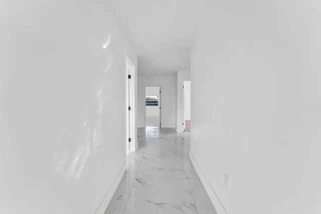 a view of a room with a hallway