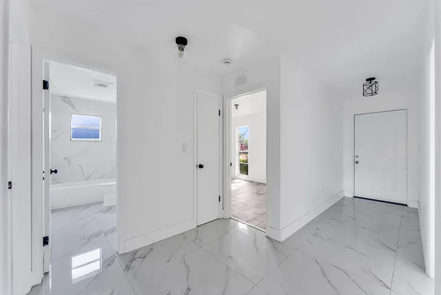 wooden floor with white walls