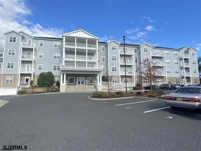 1 Mechanic Street, Unit 108 Absecon, NJ 08201 - Photo 1 of 28 a city street lined with buildings and a street