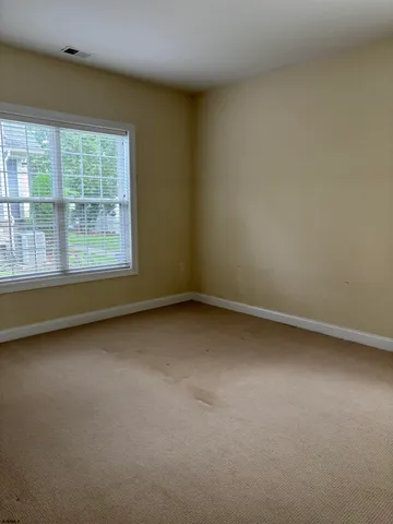 a view of a room that has a window in it