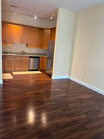 a view of kitchen with wooden floor