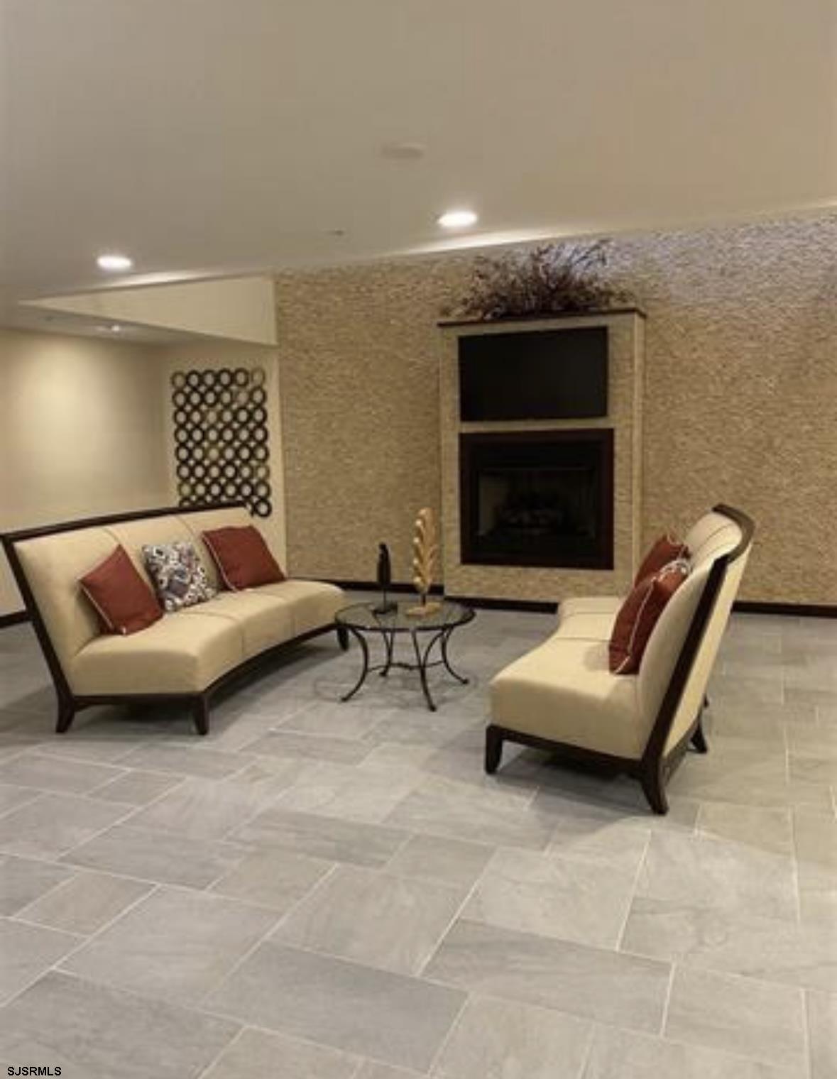 1 Mechanic Street, Unit 108 Absecon, NJ 08201 - Photo 21 of 28 a living room with furniture and a fireplace