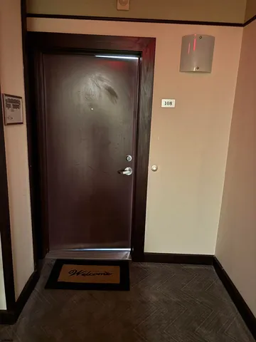 an empty room with wooden floor