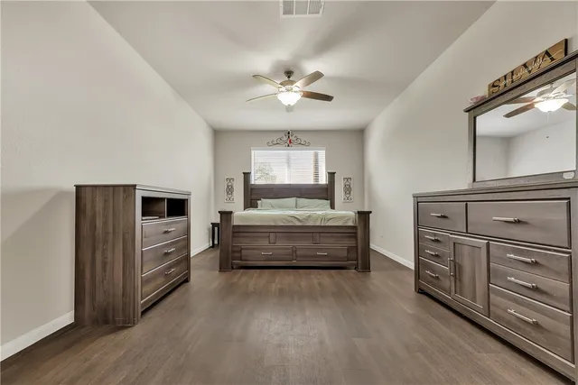 a bathroom with a tub double vanity sink and mirror