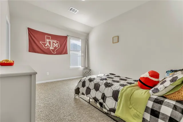 a bathroom with a granite countertop sink a large mirror and shower