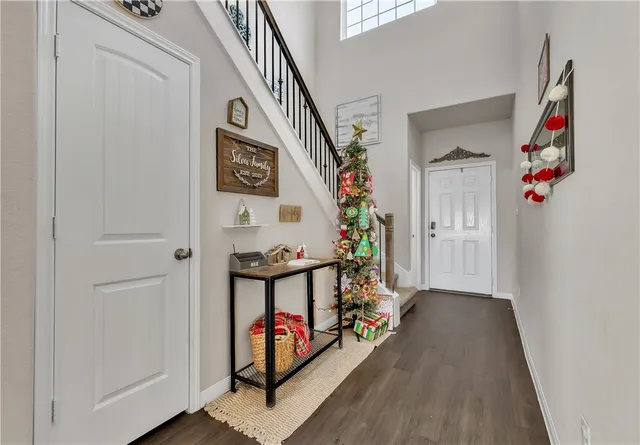a view of an entryway with wooden floor