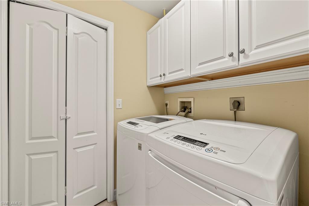 26901 Clarkston Drive, Unit 106 Bonita Springs, FL 34135 - Photo 18 of 24 a utility room with dryer and washer
