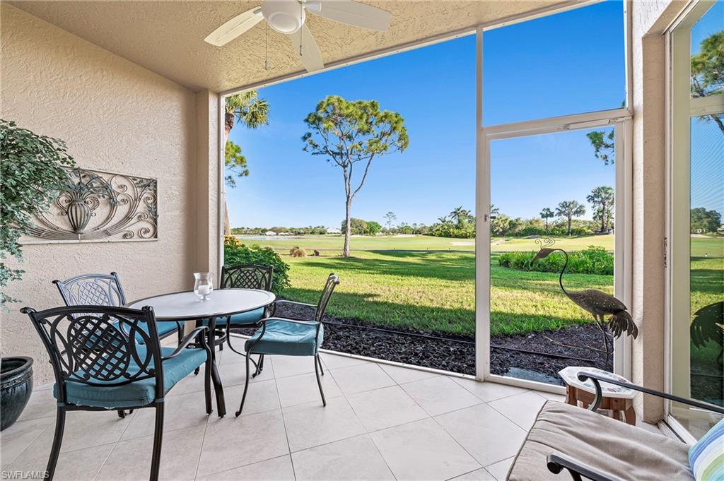 26901 Clarkston Drive, Unit 106 Bonita Springs, FL 34135 - Photo 22 of 24 a view of a porch with furniture and a yard
