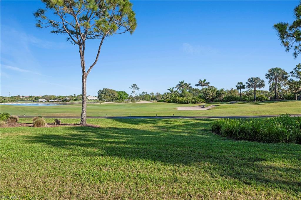 26901 Clarkston Drive, Unit 106 Bonita Springs, FL 34135 - Photo 23 of 24 a view of a garden with a tree