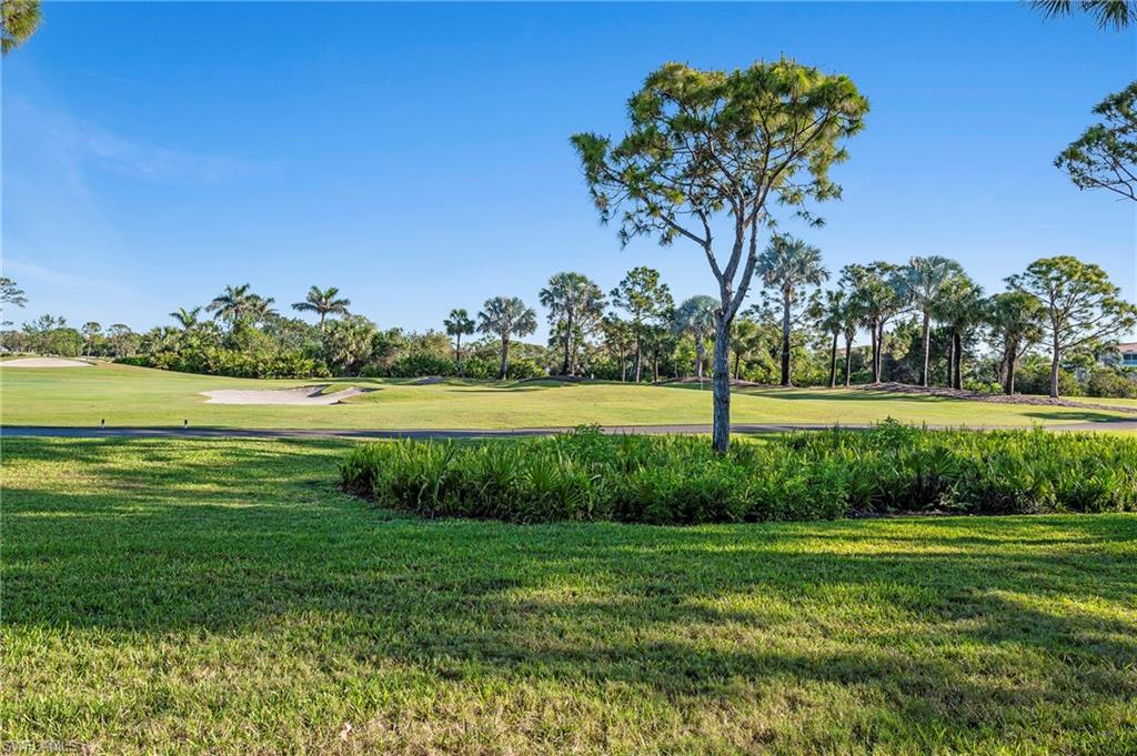 26901 Clarkston Drive, Unit 106 Bonita Springs, FL 34135 - Photo 24 of 24 a view of a golf course with a big yard