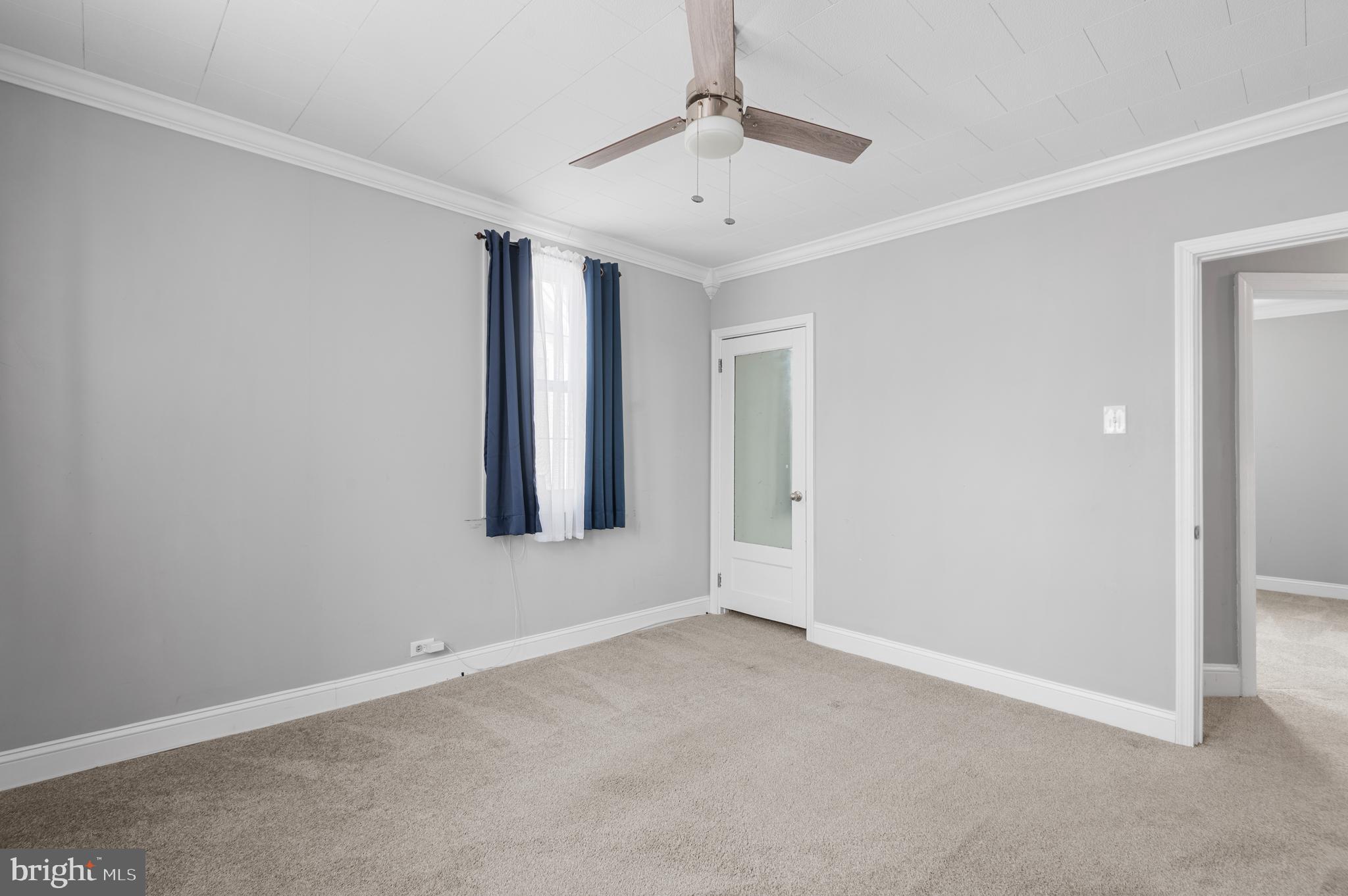 7 Harvin Road Upper Darby, PA 19082 - Photo 15 of 27 an empty room with window and ceiling fan