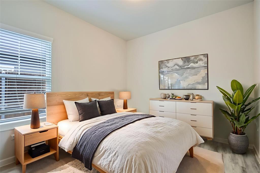 4032 Dayton Drive Forney, TX 75126 - Photo 5 of 7 a bedroom with bed and paintings on the wall