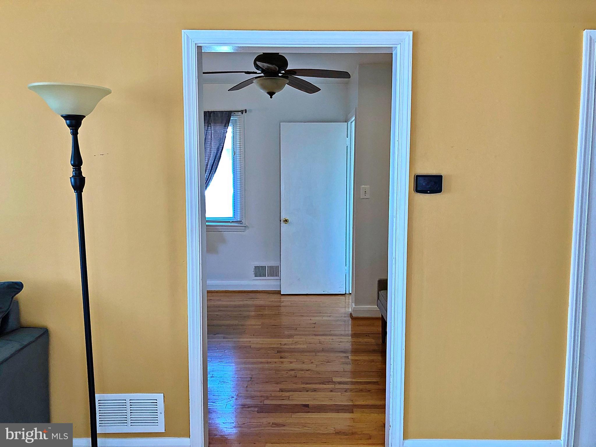 6803 Westridge Road Baltimore, MD 21207 - Photo 14 of 28 Living Room/Entrance to Kitchen