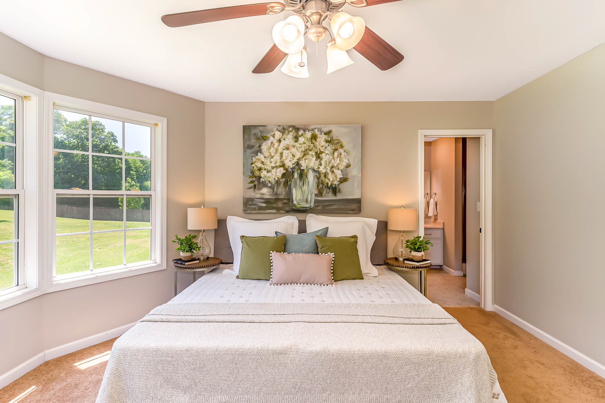 523 D V Circle Spring Hill, TN 37174 - Photo 15 of 25 a bedroom with a large bed and a chandelier